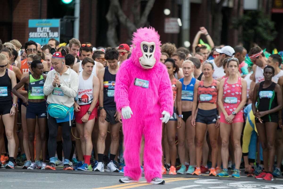 Elite runners take off from the start line of the 2018 Bay to Breakers on Howard Street on May 20, 2018.