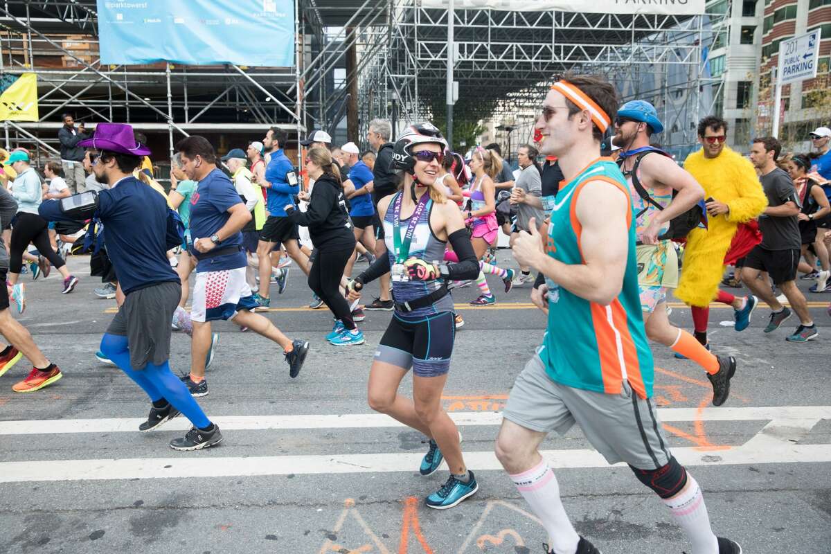 Runners take off from the start line in the 2018 Bay to Breakers on Howard Street on May 20, 2018.