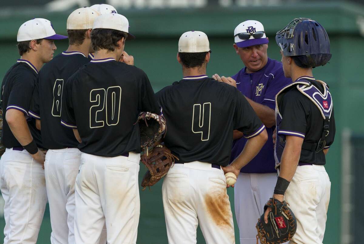 Montgomery head coach Chris Morris talks with players in the sixth inning of Game 3 during Class 6A Region II quarterfinal series on Saturday, May 19, 2018, in The Woodlands.