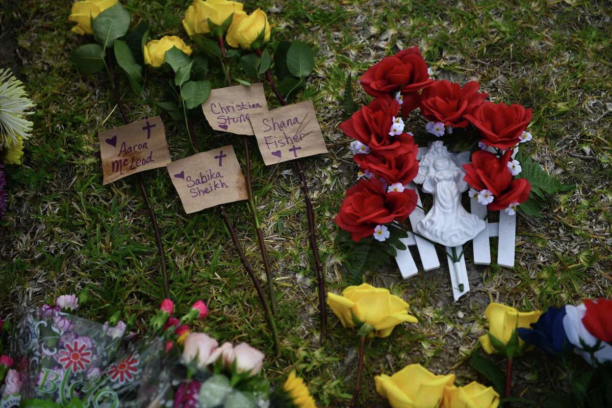 Flowers and memorials lay on the school grounds.