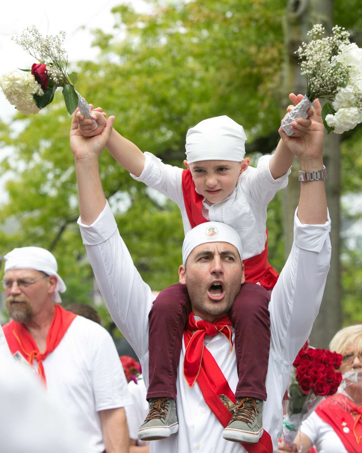 For the 97th year, Middletown residents celebrated the Feast of St. Sebastian Sunday, May 20, 2018, carrying the Saint's statue in a procession while the I Nuri runners, dressed in white with red sashes, run barefoot or in socks from the St. Sebastian Cemetery in Middlefield or the Italian Society on Court Street.