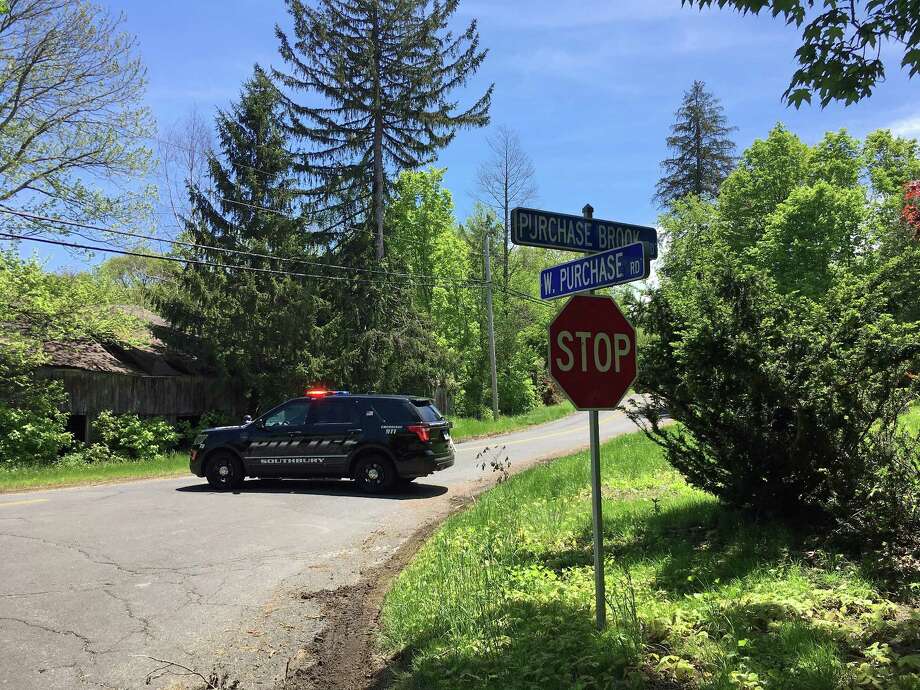 Southbury Police block Purchase Brook Road where authorities say a suspect is armed and refusing to leave. The armed stand-off began around 2 a.m. Monday, May 21,2018 after officers responded to reports a disturbance at the home. The suspect is believed to have a firearm, police said, and is refusing to leave the house. Photo: Dirk Perrefort /Hearst Connecticut Media
