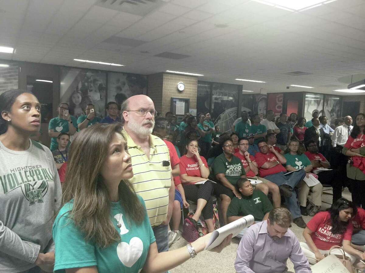 Hundreds of anxious parents and residents watch as Fort Bend ISD trustees discuss long-term plans for the district’s schools and facilities in an overflow area outside the full-to-capacity board room. Many more were turned away at the door by police after the lobby area became too full to navigate safety on Monday, May 14.