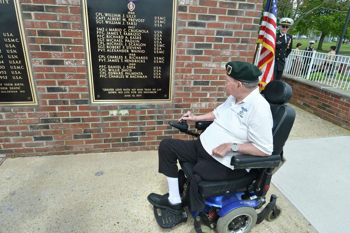U.S. Army veteran David Cole looks over the refurbished plaques at the Shea-Macgrath Memorial & Veterans Hall of Honor.