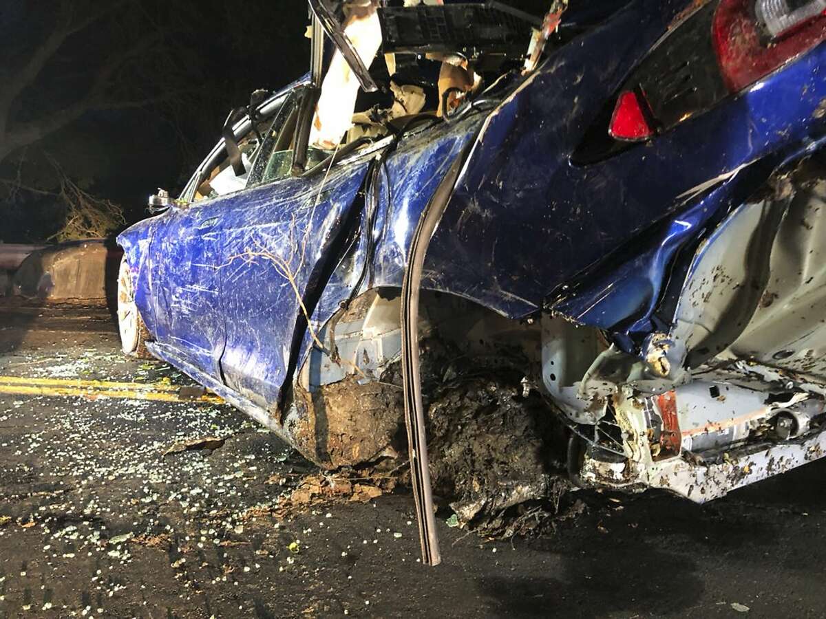This photo provided by NBC Bay Area-KNTV shows a Tesla car after it was pulled from a pond near the city of San Ramon, Calif., on Monday, May 21, 2018. Authorities in the San Francisco Bay Area are investigating the death of a man after the Tesla car he was driving veered off a road, crashed through a fence and into a pond. (Bob Rendell/NBC Bay Area/KNTV via AP)