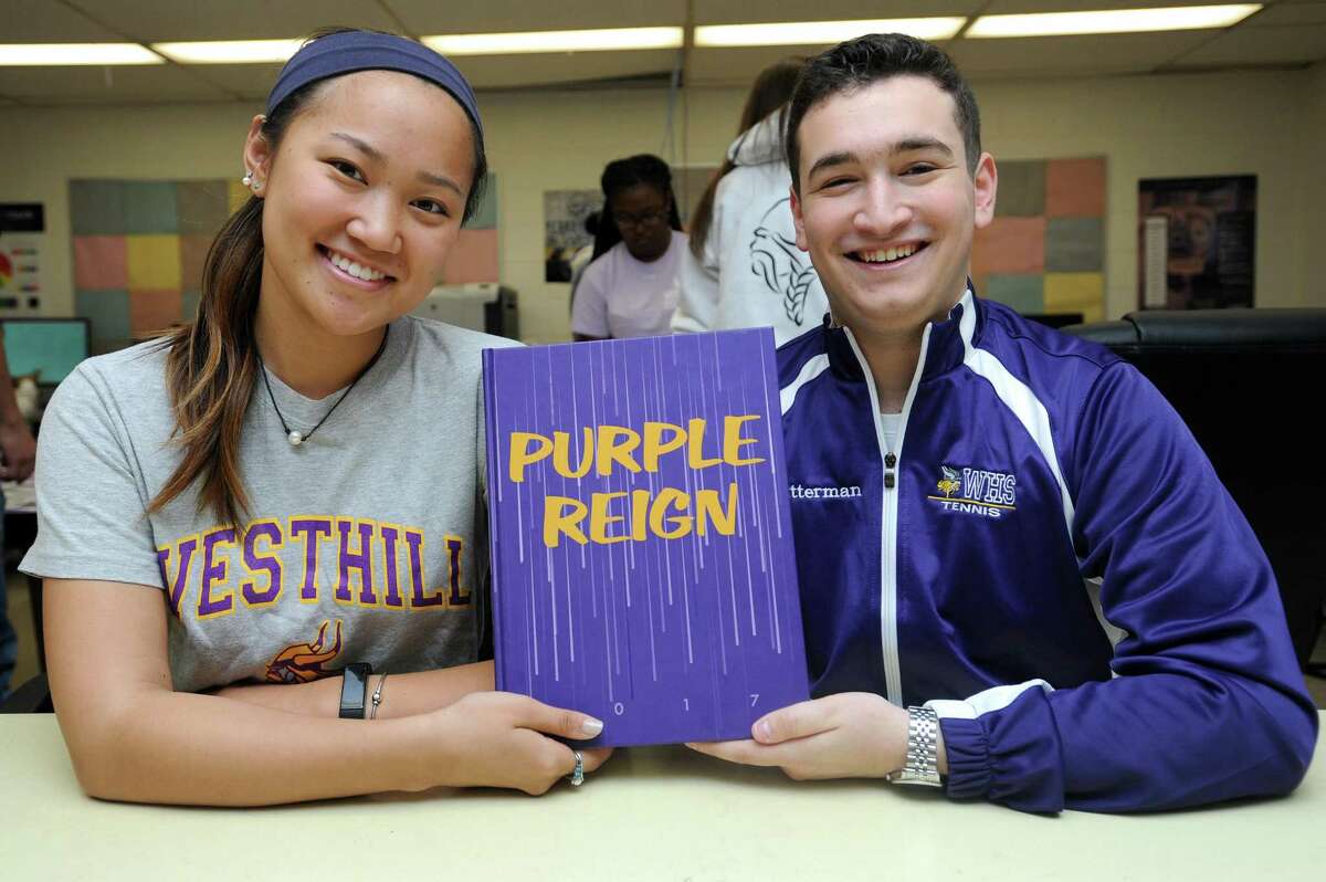 Former yearbook editors-in-chief Trish Kelley and Andy Putterman pose with the 2017 Westhill High School yearbook, which was recently awarded "First Place with Special Merit" by the American Scholastic Press Association, inside Westhill High School in Stamford, Conn. on Thursday, May 17, 2018. The award, which only 16 high schools across the country won, is the highest level of distinction for high school yearbooks.