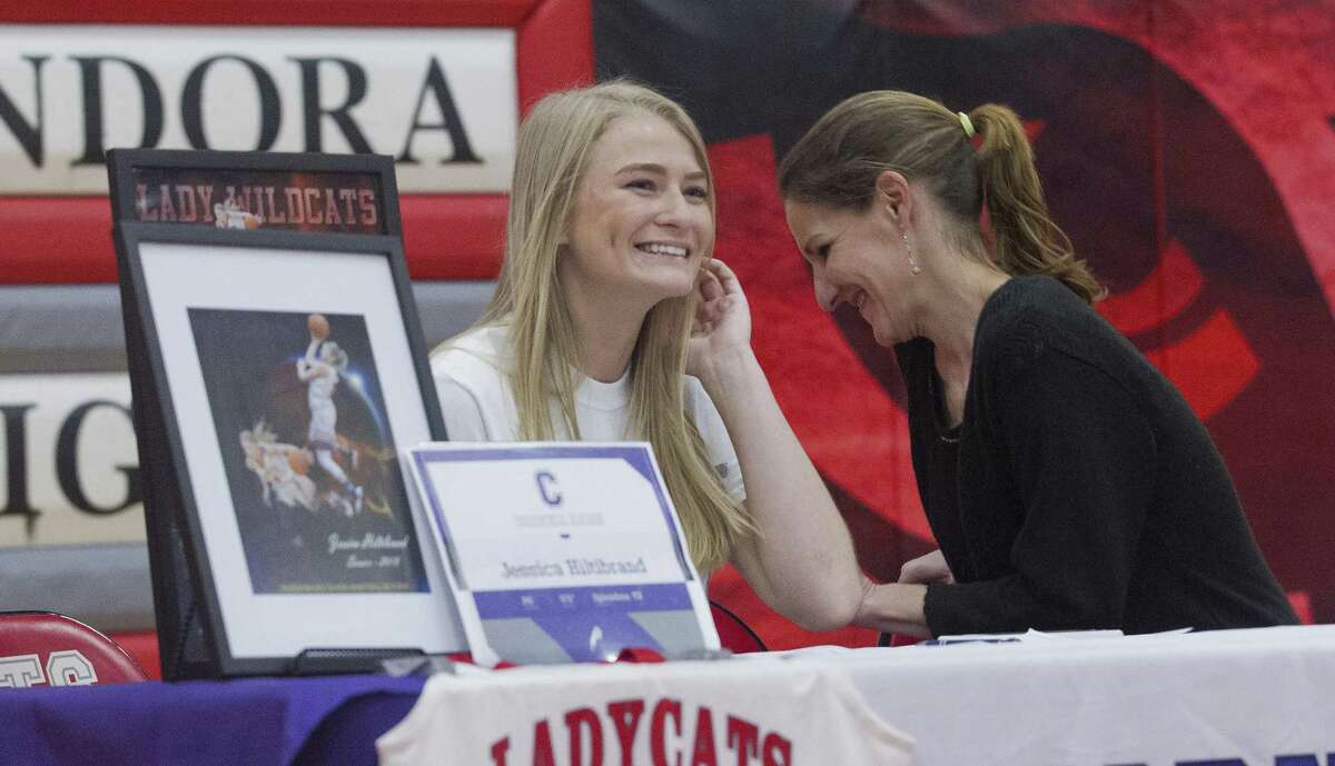 Jessica Hiltibrand shares a laugh after signing to play basketball for Cornell College during a signing ceremony at Splendora High School on Thursday, May 17, 2018, in Splendora.