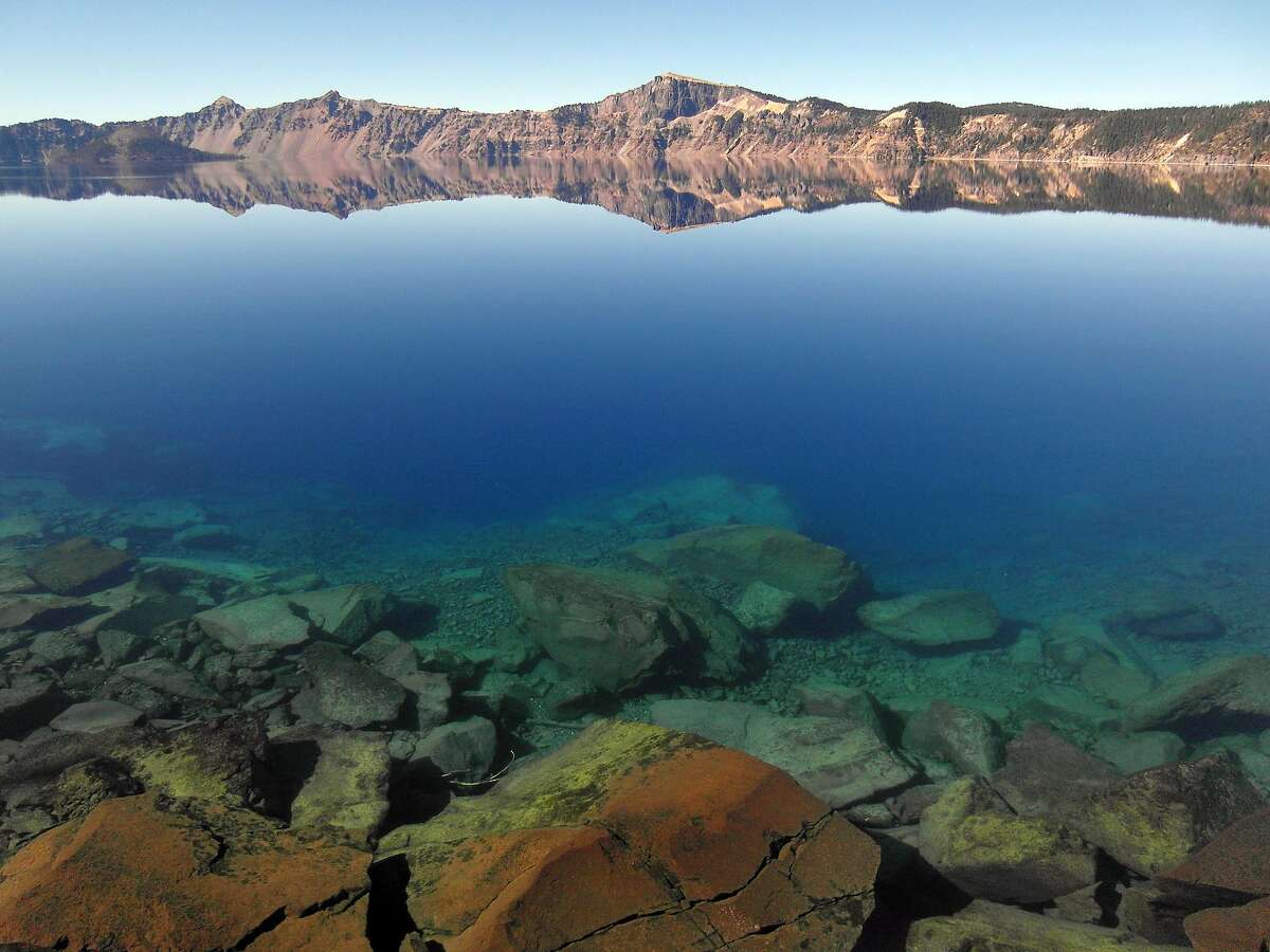 A view from the shore or Crater Lake, with Llao Rock in the distance.