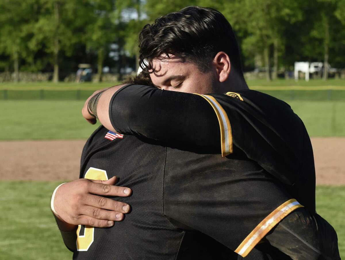 Brunswick shortstop Aaron Sabato, right, hugs pitcher Trystan Sarcone after Brunswick's 4-3 win over Hopkins in the Fairchester Athletic Association (FAA) high school baseball championship game at Brunswick School in Greenwich, Conn. Monday, May 21, 2018.