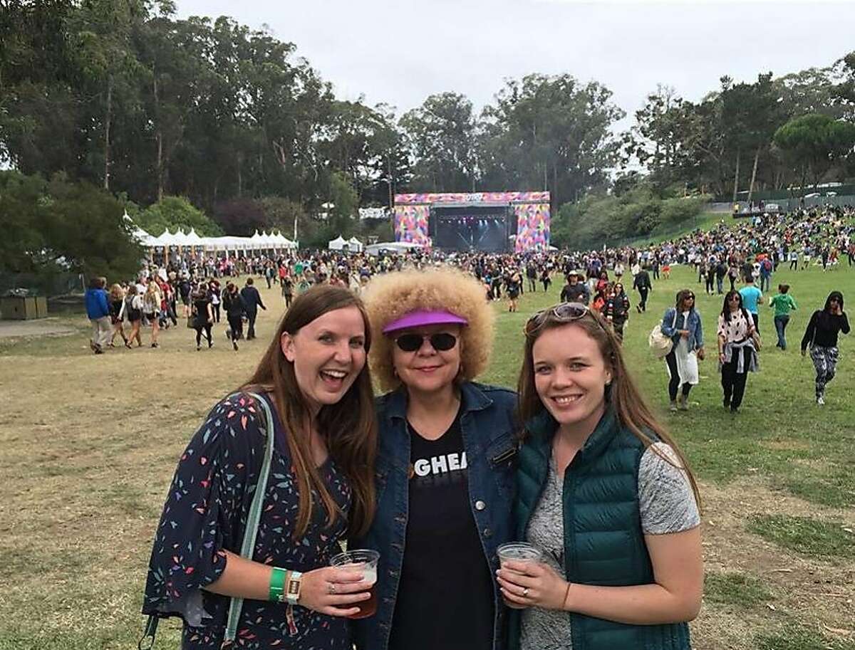 Rosalie Howarth (center) in her "Foghead" T-shirt at Hardly Strictly Bluegrass in 2015 with daughters Holly Howarth (left) and Amanda Chrysovergis.