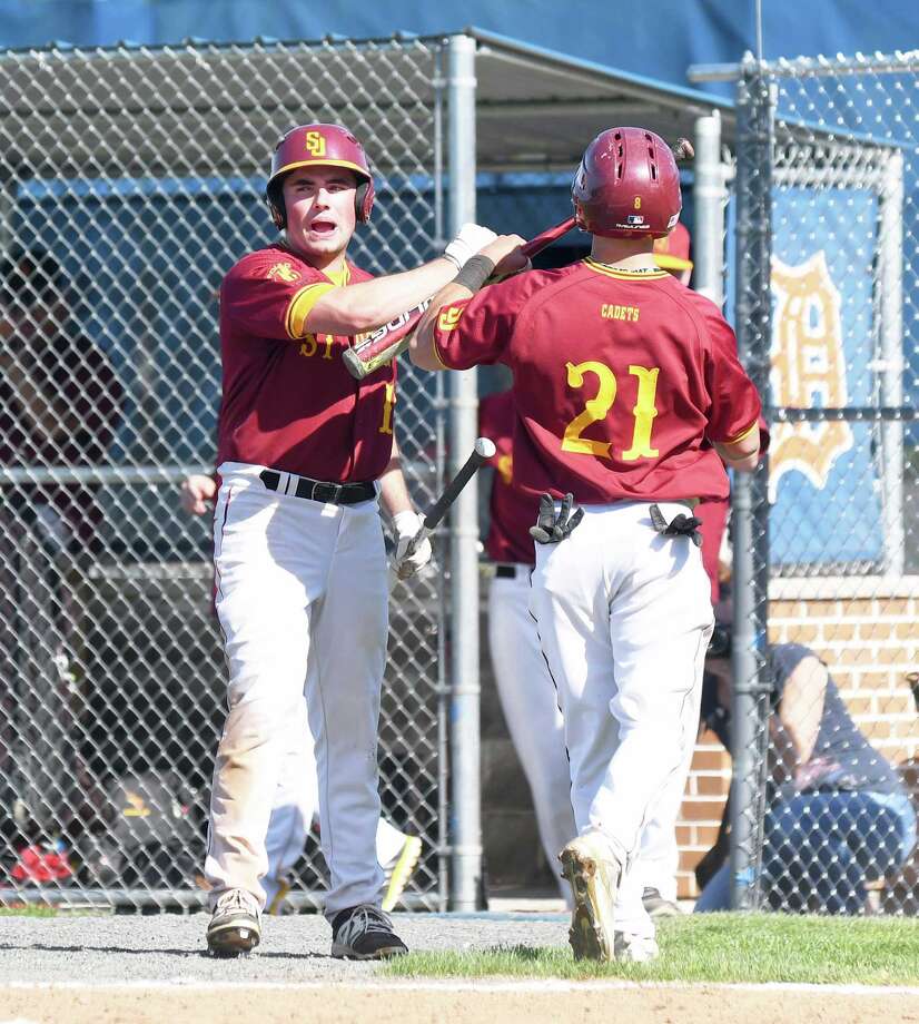 joseph08s jim evans, left, congratulates connor murphy on his