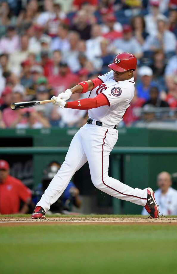 Washington Nationals' Juan Soto follows through on his three-run home run during the second inning of a baseball game against the San Diego Padres, Monday, May 21, 2018, in Washington. This was his first major league hit. (AP Photo/Nick Wass) Photo: Nick Wass / FR67404 AP