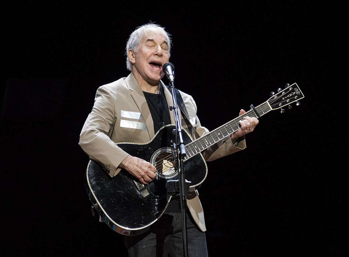 FILE - In this May 16, 2018 file photo, Paul Simon kicks off his Homeward Bound: The Farewell Tour in Vancouver, British Columbia. Simon, who's 76, isn't retiring. He has a disc due out this fall and promises he'll still occasionally appear on stage. Since he started writing songs as a teen-ager, it's hard to imagine that impulse shutting off forever. He�s done with the idea of long concert tours, so if you live in Greensboro, Austin or Orlando and want to see him perform, this is it. (Jimmy Jeong/The Canadian Press via AP)