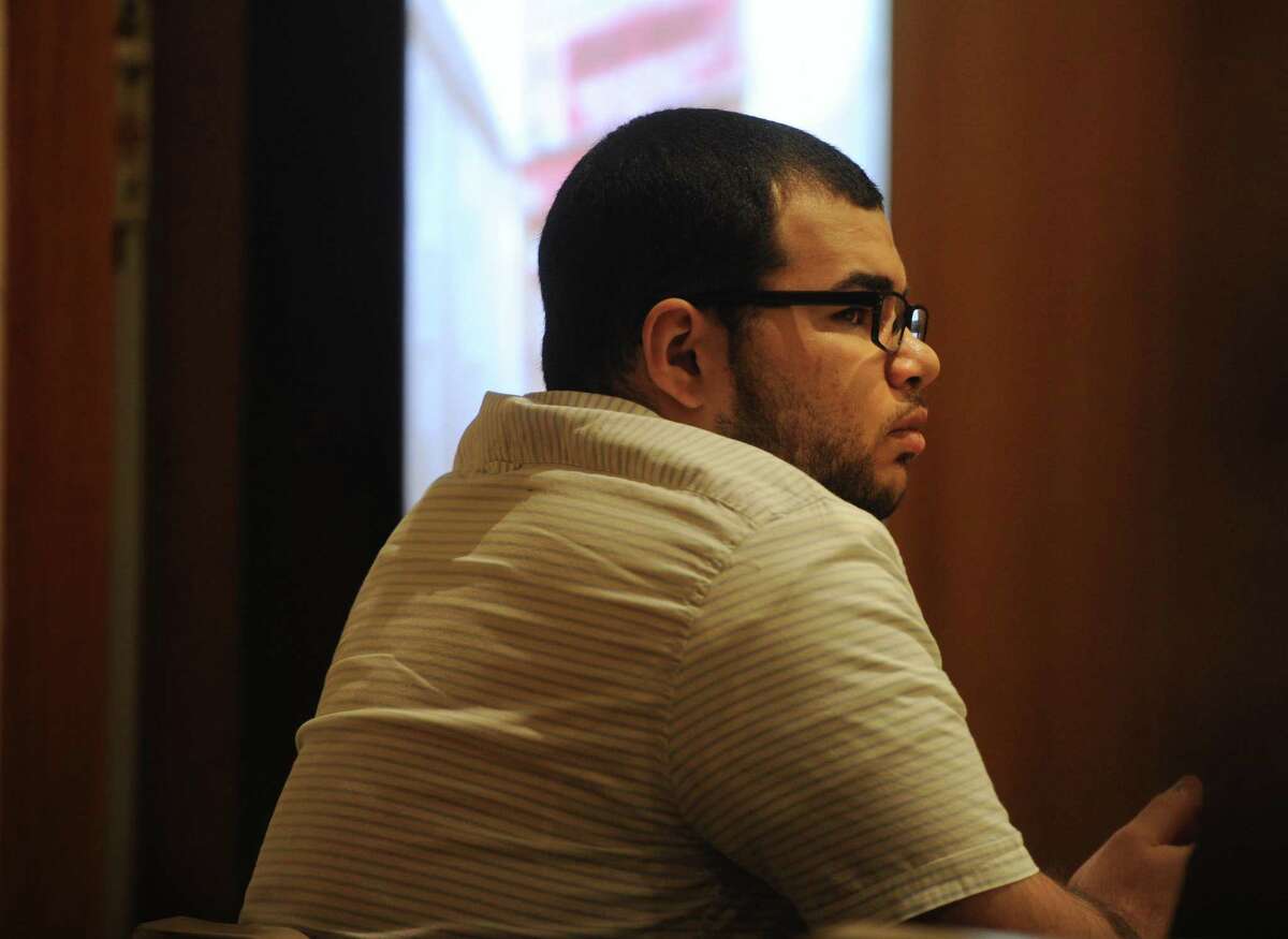 Treizy Lopez, of West Haven, listens to testimony as the state presents its case in his trial for the April 11, 2015 murder of popular Bridgeport store owner Jose Salgado in Superior Court in Bridgeport, Conn. on Tuesday, May 22, 2018.