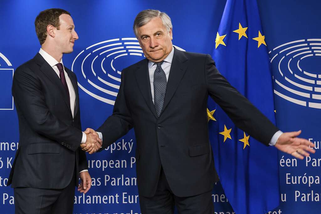 European Parliament President Antonio Tajani, right, welcomes Facebook CEO Mark Zuckerberg upon his arrival at the EU Parliament in Brussels on Tuesday, May 22, 2018. Facebook CEO Mark Zuckerberg faces senior European Union lawmakers today to answer questions about a scandal over the alleged misuse of the data of millions of Facebook users. (AP Photo/Geert Vanden Wijngaert) Photo: Geert Vanden Wijngaert / Associated Press