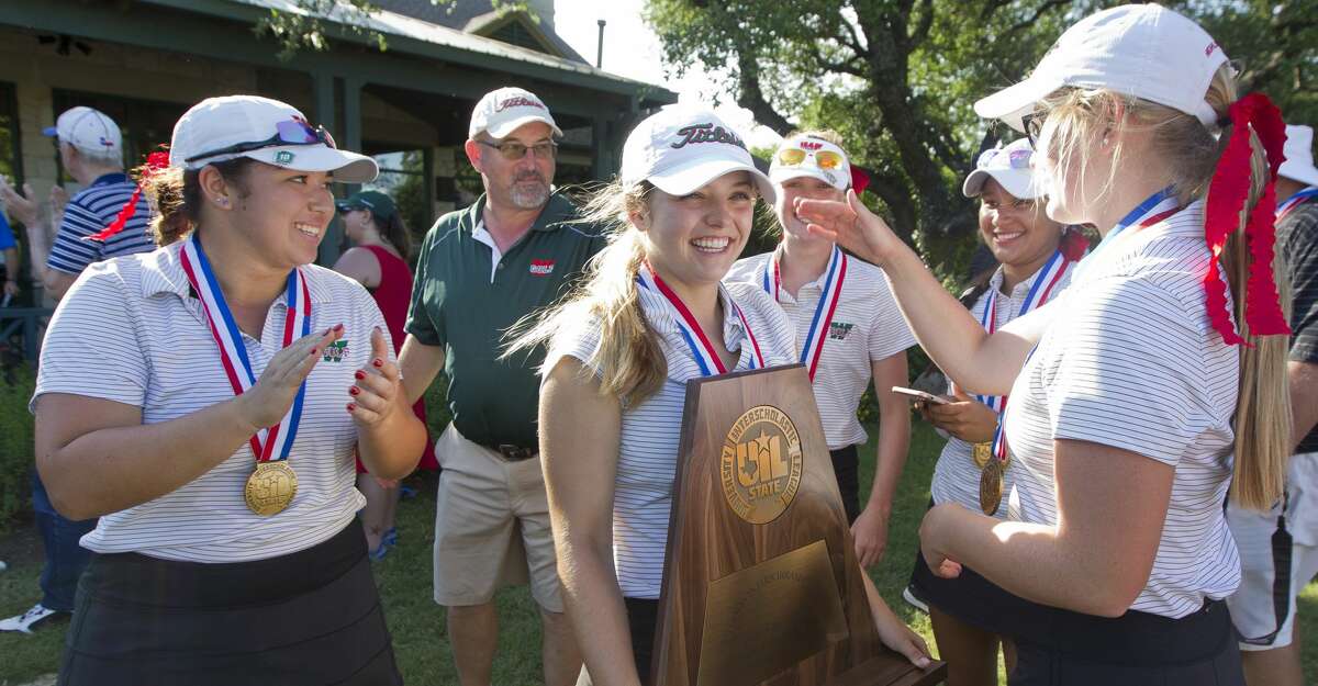 Karina Benavides of The Woodlands, center, reacts after the Lady Highlanders finished third overall in the Class 6A UIL State Golf Championships at Legacy Hills Golf Club, Tuesday, May 22, 2018, in Georgetown.