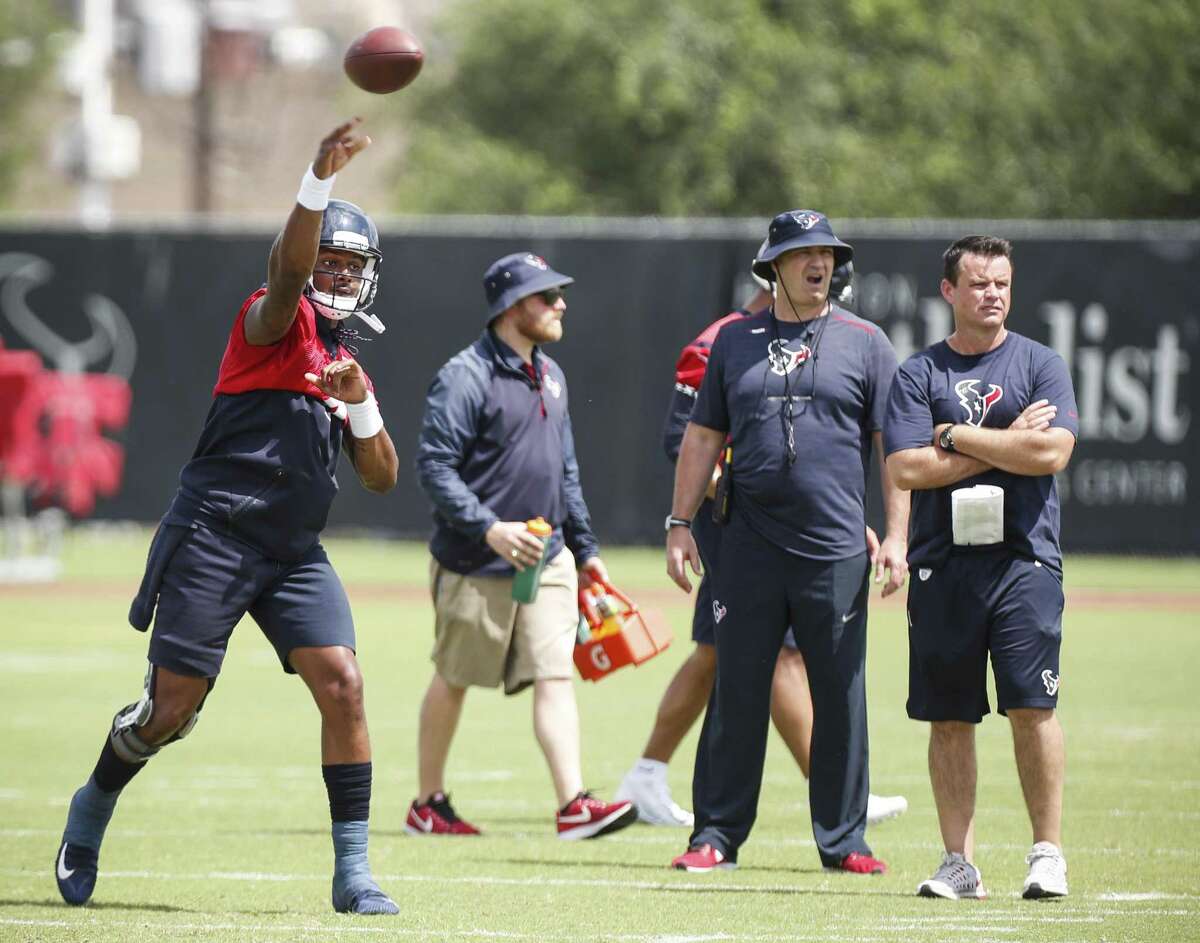 Houston Texans quarterback Deshaun Watson (4) throws a pass in front of head coach Bill O'Brien, center, and quarterbacks coach Sean Ryan during Organized Team Activities at The Methodist Training Center on Tuesday, May 22, 2018, in Houston. ( Brett Coomer / Houston Chronicle )