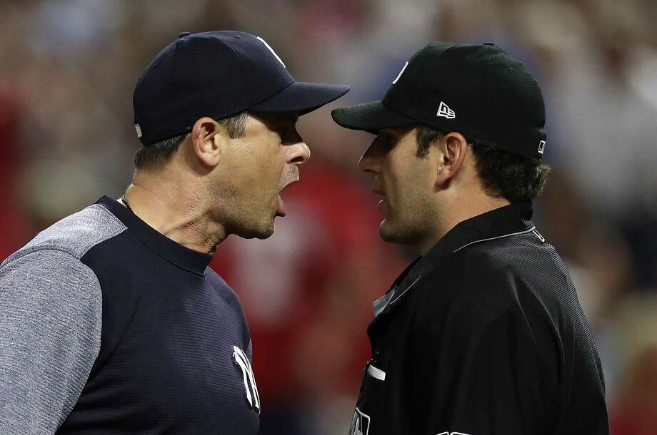 ARLINGTON, TX - MAY 22:  Manager Aaron Boone of the New York Yankees argues with homeplate umpire Pat Hoberg #31 after he was ejected from the game against the Texas Rangers at Globe Life Park in Arlington on May 22, 2018 in Arlington, Texas.  (Photo by Ronald Martinez/Getty Images) Photo: Ronald Martinez / 2018 Getty Images