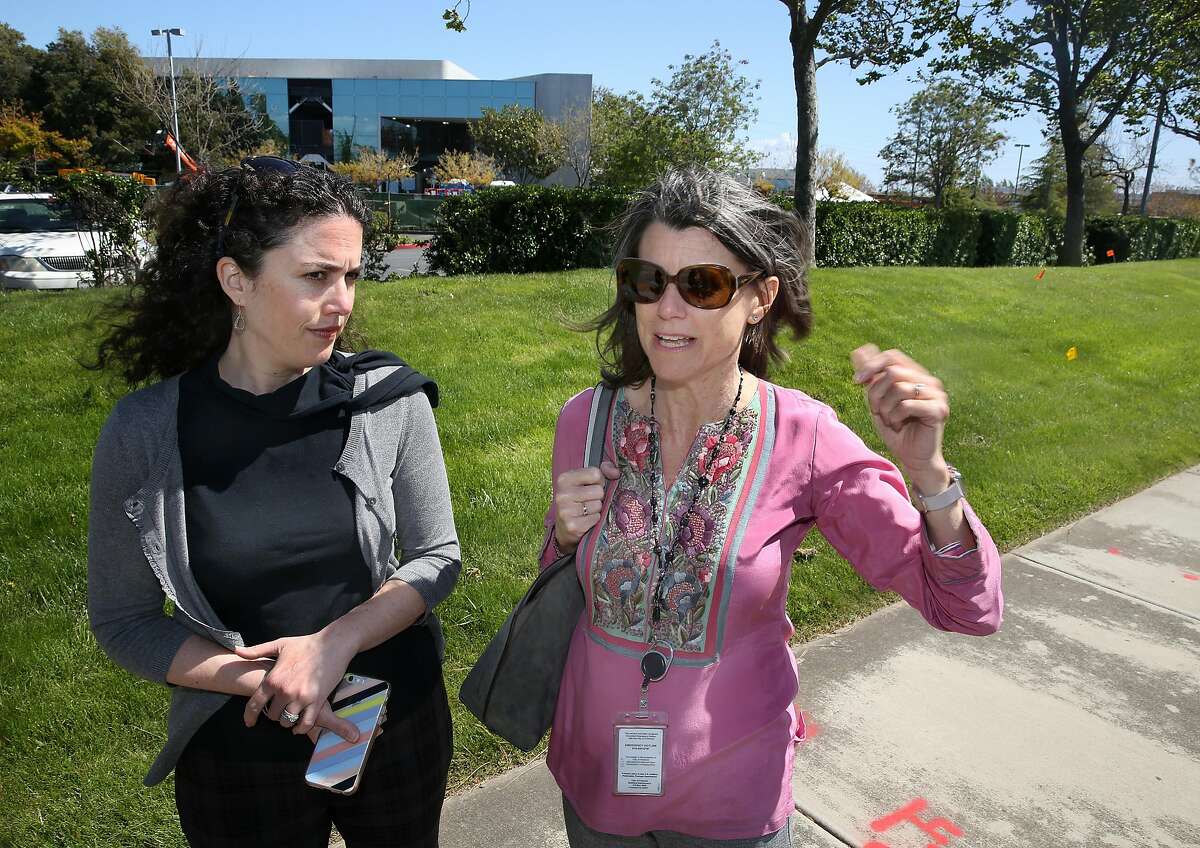 Deputy director Christina Briggs (left) of Economic Development/assistant to the City Manager, and Economic Development director/ chief innovation officer Kelly Kline (right) show one of the two buildings which Facebook leased behind them on Thursday, April 19, 2018, in Fremont, Calif.