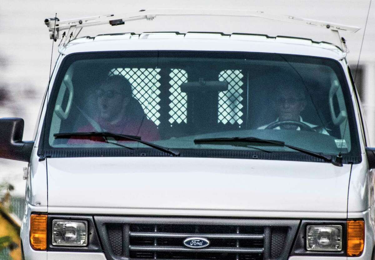 Mark Scirocco, left, the son of Anthony "Skip" Scirocco, is driven around by Phil "Skip" Colucci, right, as the pair leave the DPW yard at 7:00 a.m. on Wednesday May 23, 2018, in Saratoga Springs, N.Y. The younger Scirocco is no longer allowed to drive a DPW van because it violates the city's Fleet Safety Policy, which states that a city cannot allow anyone with a conditional, temporary, restricted or suspended license to operate its vehicles. (Skip Dickstein/Times Union)