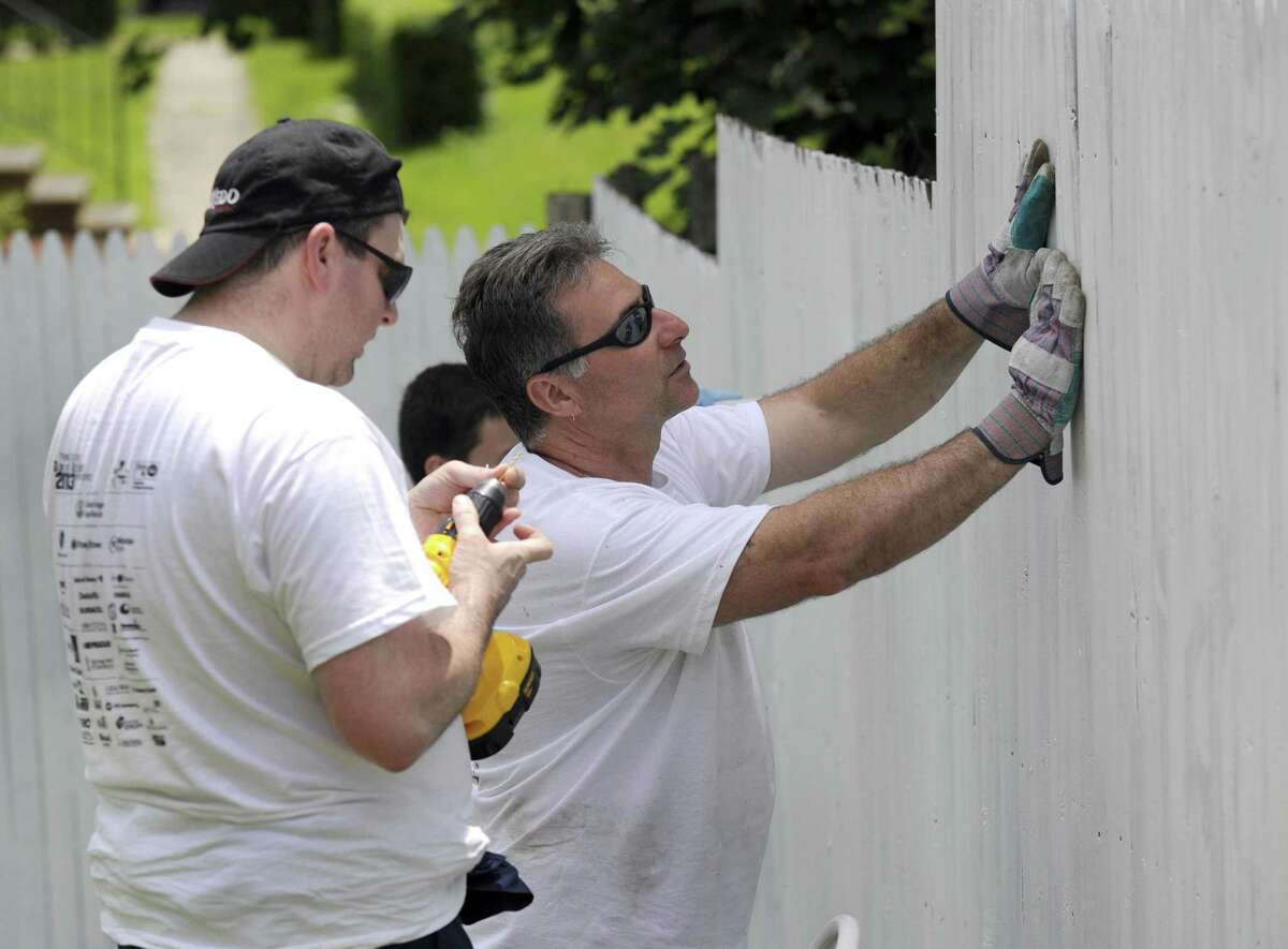 UTC Aerospace employees volunteer in June 2013 at Renewal House in Danbury, Conn. Parent company United Technologies pledged on May 23, 2018 to add thousands of U.S. jobs, with the Farmington-based conglomerate the largest corporate employer in Connecticut.