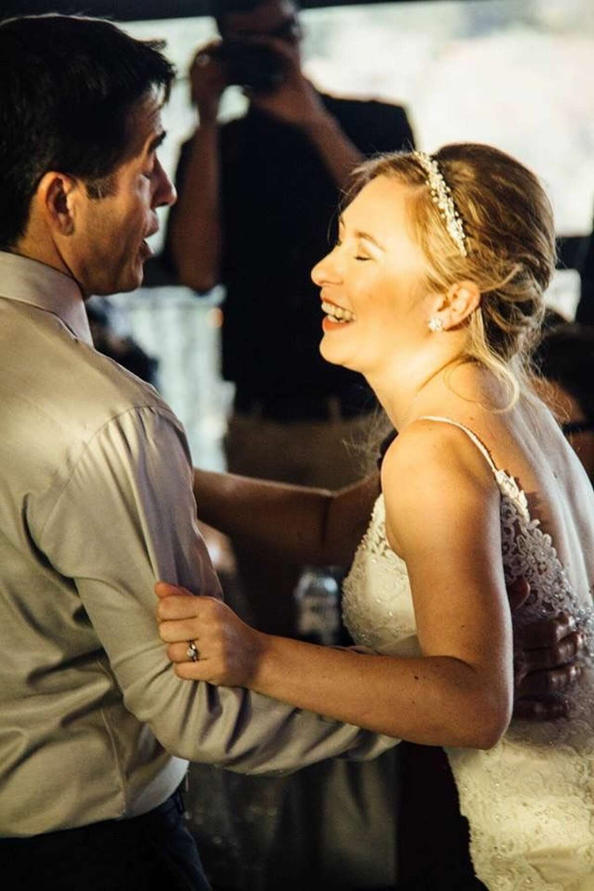 Hailey Reyes (right) dances with her father, Michael Reyes, at her wedding in December 2016. The two were shot May 12 at a home in the 700 block of Dogwood Trail in Cedar Park, Texas.