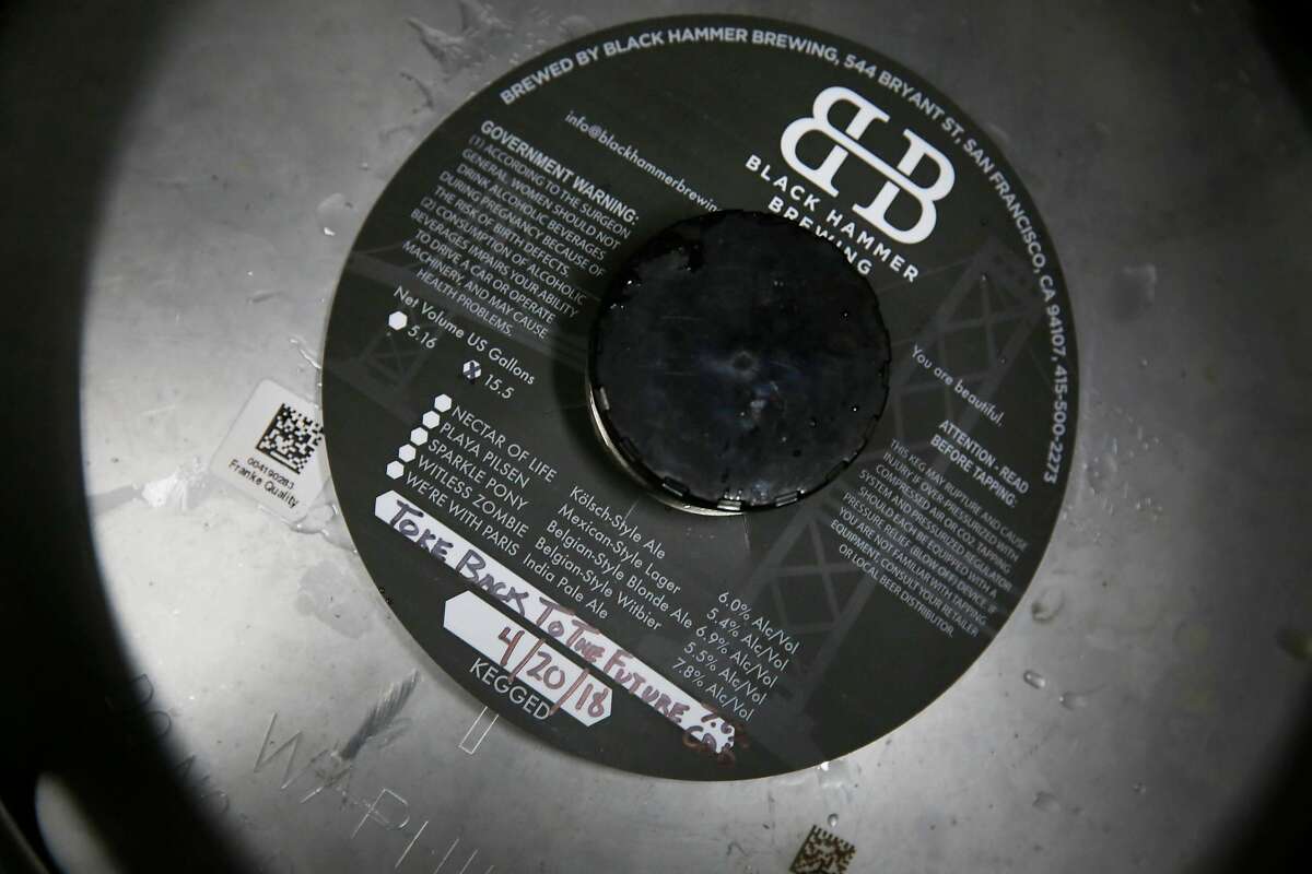 A label for Toke Back to the Future is seen on a keg at Black Hammer Brewing on Wednesday, May 23, 2018 in San Francisco, Calif.