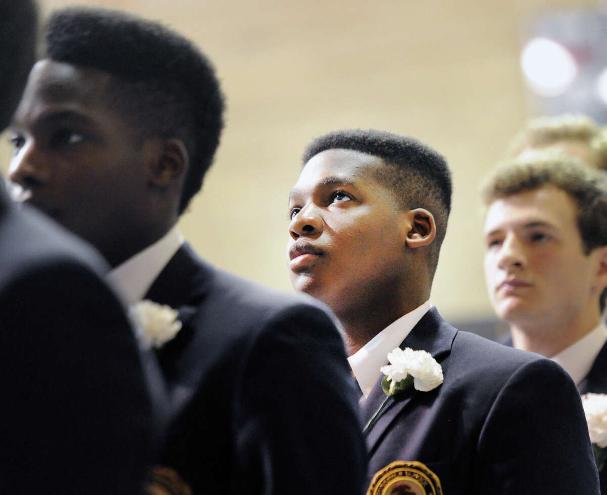 Eromosei Daniel Osemobor, 18, of Stamford, during his Brunswick School commencement in the Dann Gymnasium at the school in Greenwich, Conn., Wednesday, May 23, 2018. Osemobor said he will be attending Washington University in St. Louis and will be studying to become a medical doctor. Ninety-nine students graduated.
