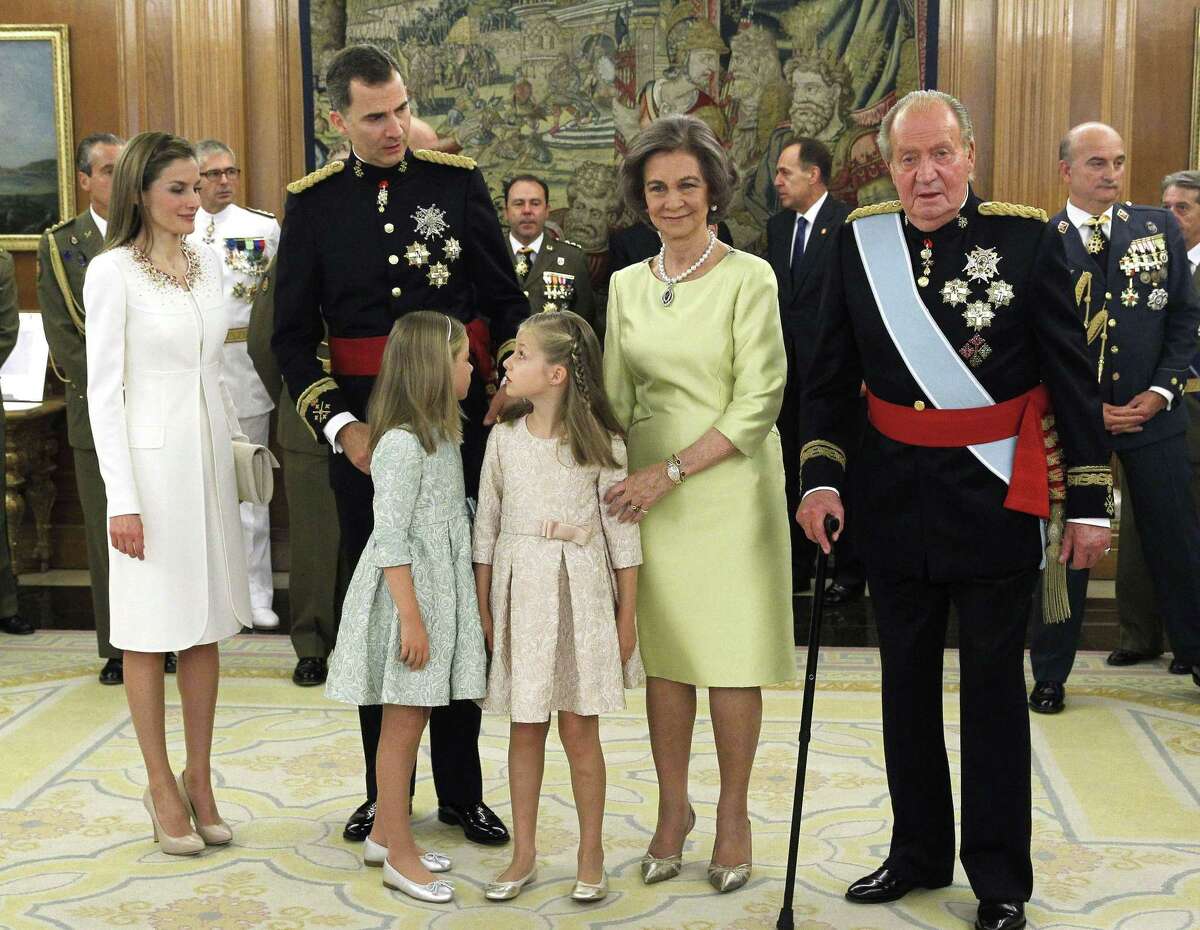 Spain's Queen Letizia, (from left) Spain's King Felipe VI, Spanish Princess Sofia, Spanish Crown Princess of Asturias Leonor, Spain's former Queen Sofia and Spain's former King Juan Carlos stand during a handing-over ceremony for the sash of the Capitain General in the Chamber of Audiences at the Zarzuela Palace. Spain's King Felipe VI began his reign in 2014.