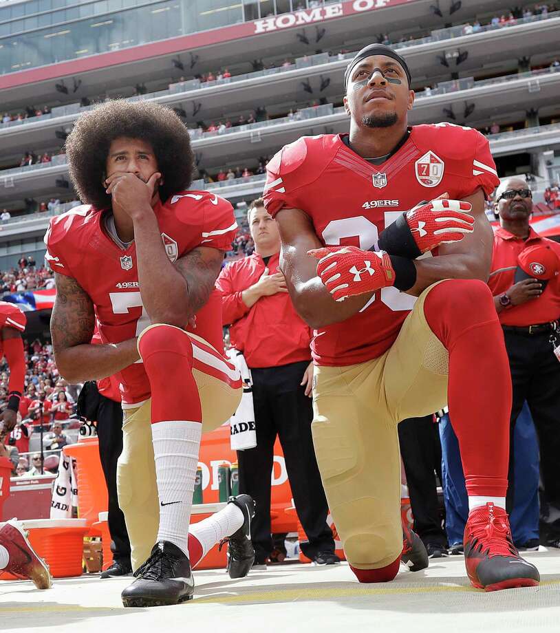 FILE - In this Oct. 2, 2016, file photo, San Francisco 49ers quarterback Colin Kaepernick, left, and safety Eric Reid kneel during the national anthem before an NFL football game against the Dallas Cowboys in Santa Clara, Calif. The NFL players' union has filed a non-injury grievance on behalf of free agent safety Eric Reid. The NFLPA cites one team appearing "to have based its decision not to sign a player based on the player's statement that he would challenge the implementation of a club's policy prohibiting demonstration during the national anthem. (AP Photo/Marcio Jose Sanchez, File) Photo: Marcio Jose Sanchez / Copyright 2016 The Associated Press. All rights reserved.