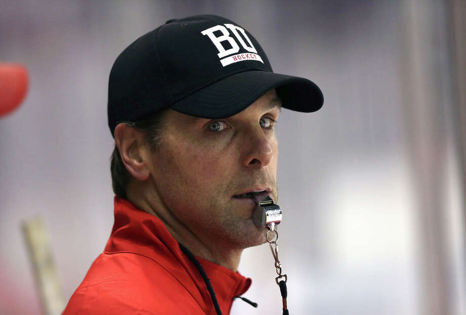 In this Sept. 23, 2015 photo, Boston University head coach David Quinn watches hockey practice in Boston. The New York Rangers hired Boston Universitys David Quinn as their new head coach Wednesday, May 23, 2018 the second college coach hired by an NHL team this month and third in the past four years. (Barry Chin/The Boston Globe via AP) Photo: Barry Chin / The Boston Globe