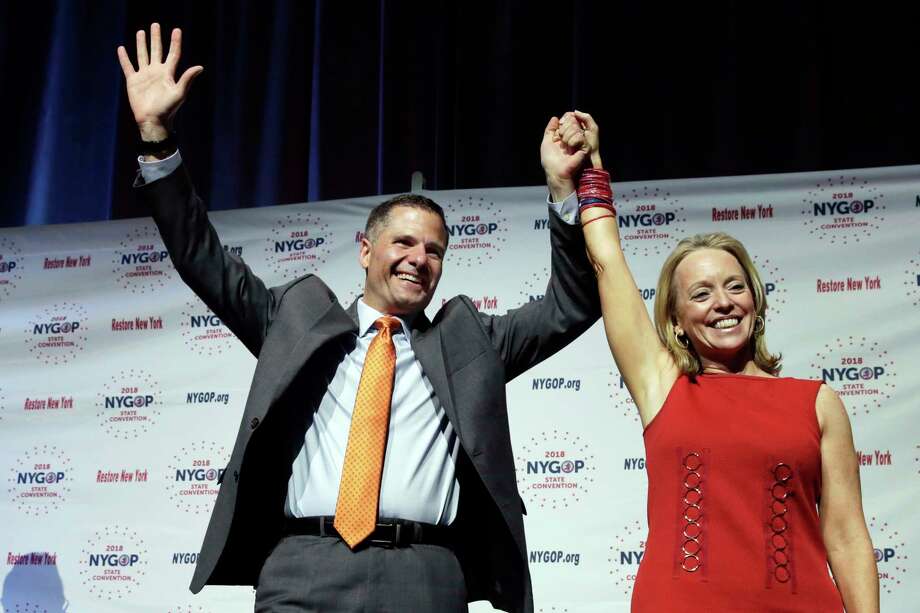 Dutchess County Executive Marc Molinaro, Republican candidate for governor, and Julie Killian, his running mate for lieutenant governor, acknowledge delegates' applause at the New York state Republican Convention, in New York, Wednesday, May 23, 2018. Delegates endorsed the 42-year-old Molinaro Wednesday at the GOP's state convention in Manhattan. He had faced a challenge for the nomination from state Sen. John DeFrancisco of Syracuse. (AP Photo/Richard Drew) Photo: Richard Drew / AP
