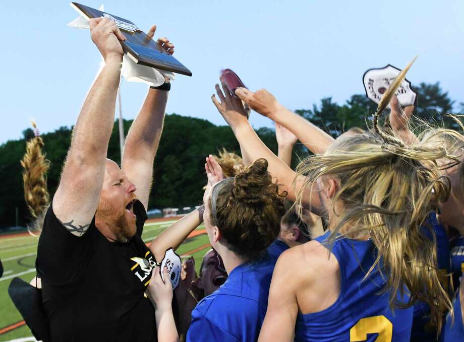 Queensbury head coach Dave Huth celebrates a  9-8 win with his players against  Niskayuna during a Section II Class B girls' lacrosse final Wednesday, May 23, 2018, in Rotterdam, N.Y. (Hans Pennink / Special to the Times Union) Photo: Hans Pennink / Hans Pennink