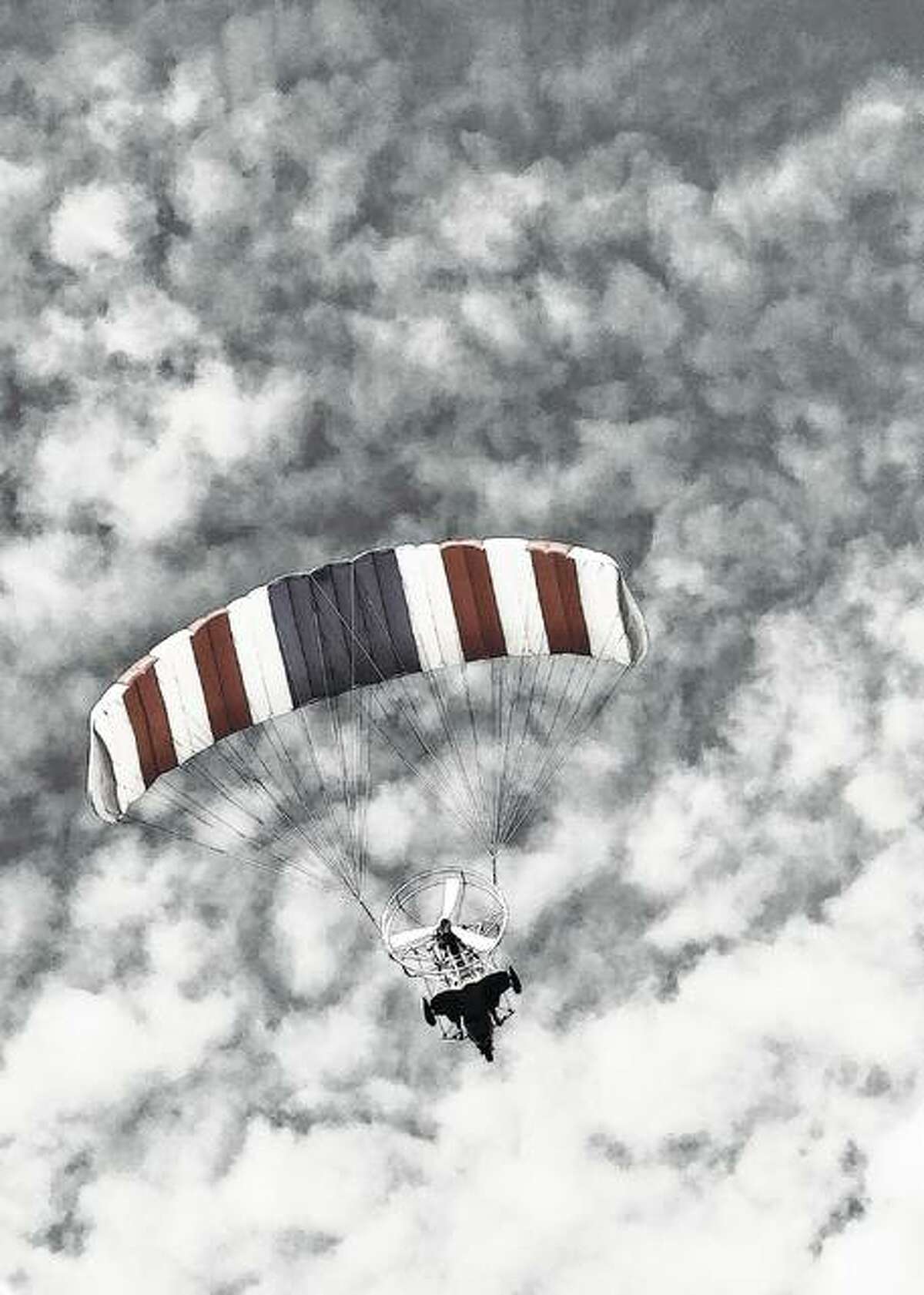 Lainee Ford of Franklin captured a patriotic-colored powered parachute in flight among the clouds.