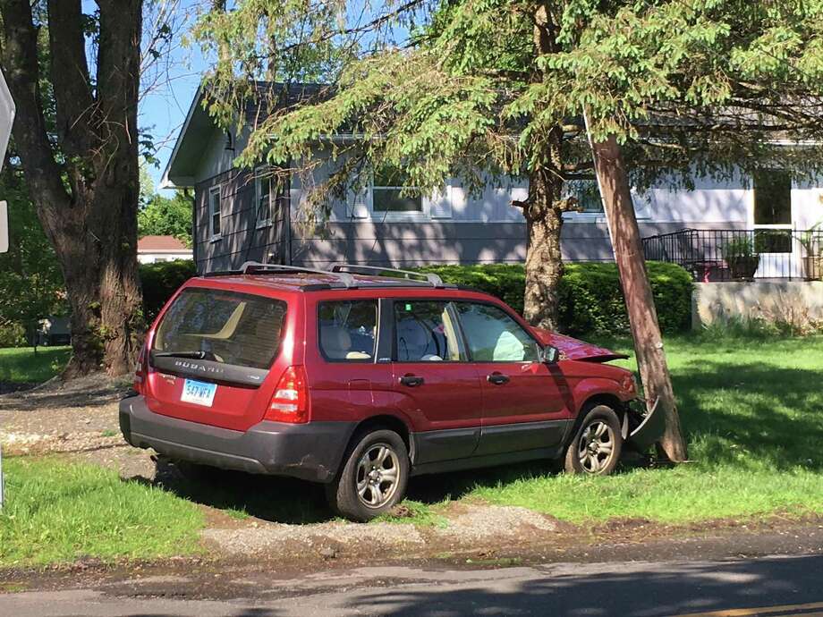Stadley Rough Road was closed Thursday after a car slammed into a utility pole. Photo: / Dirk Perrefort