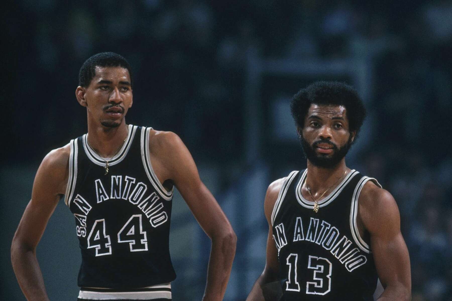 San Antonio Spurs' George Gervin stands next to James Silas on the
