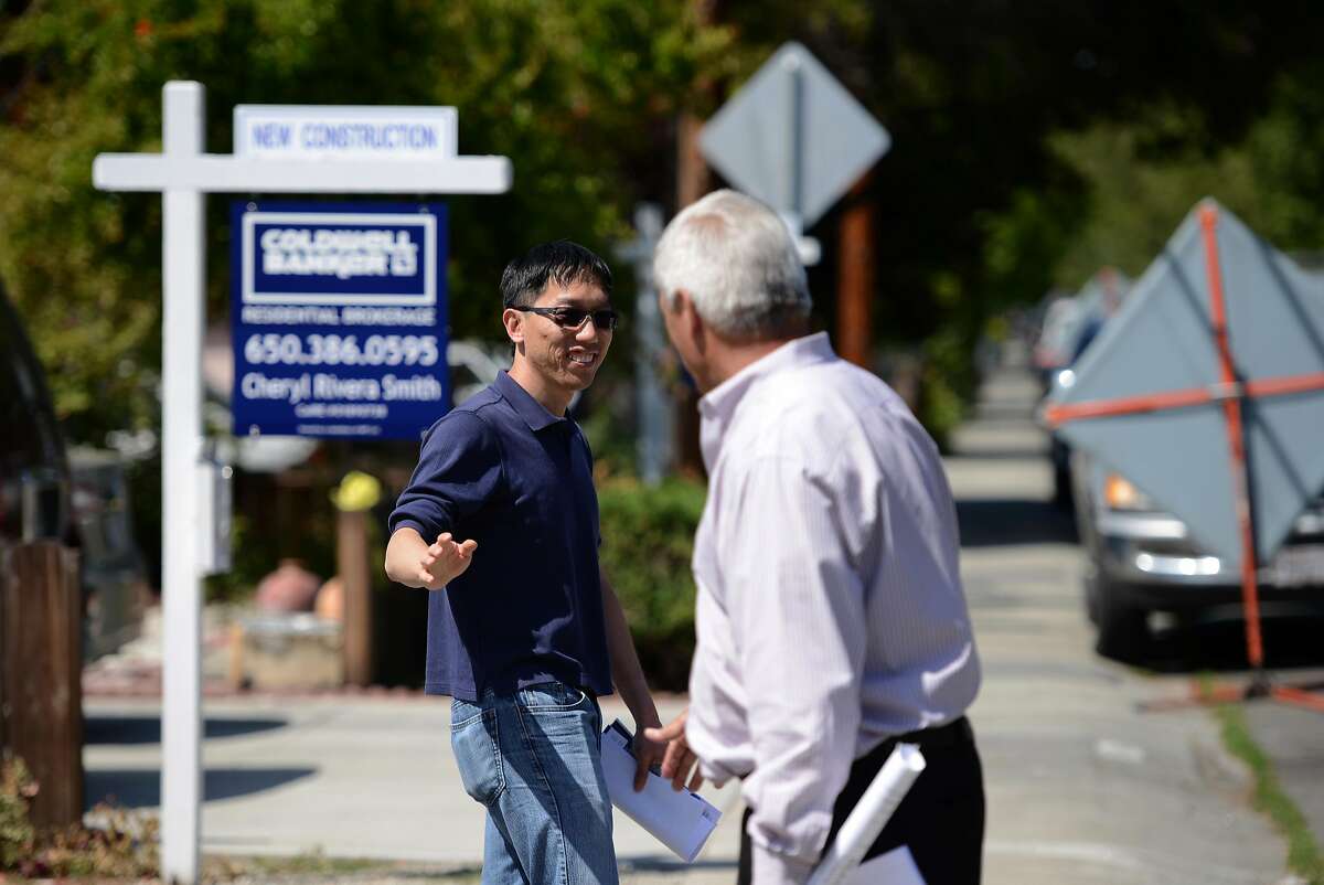 Mountain View resident John Xia bids farewell to builder/developer Fred Weaver after their meeting during an Open House at 372 / 394 Farley Street in Mountain View on Saturday May 19, 2018.