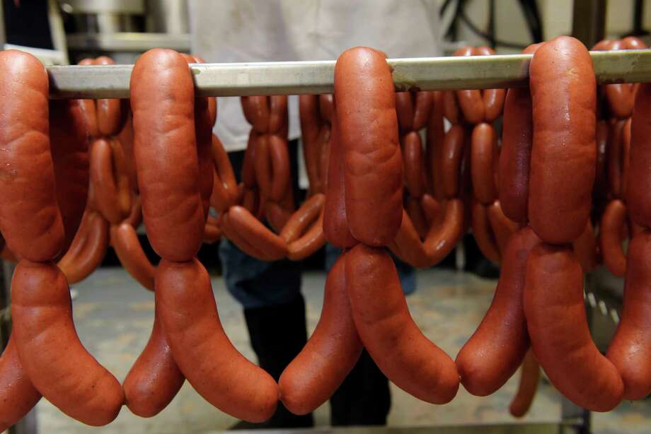 knackwurst is seen on a rack after being removed from the smoker at RolfÕs Pork Store on Wednesday, May 23, 2018, in Albany, N.Y.   (Paul Buckowski/Times Union) Photo: PAUL BUCKOWSKI, Albany Times Union / (Paul Buckowski/Times Union)
