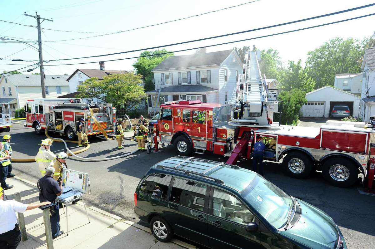 Fire fighters battle a fire on Soundview Ave. in Stamford, Conn. on Thursday, May 24, 2018.