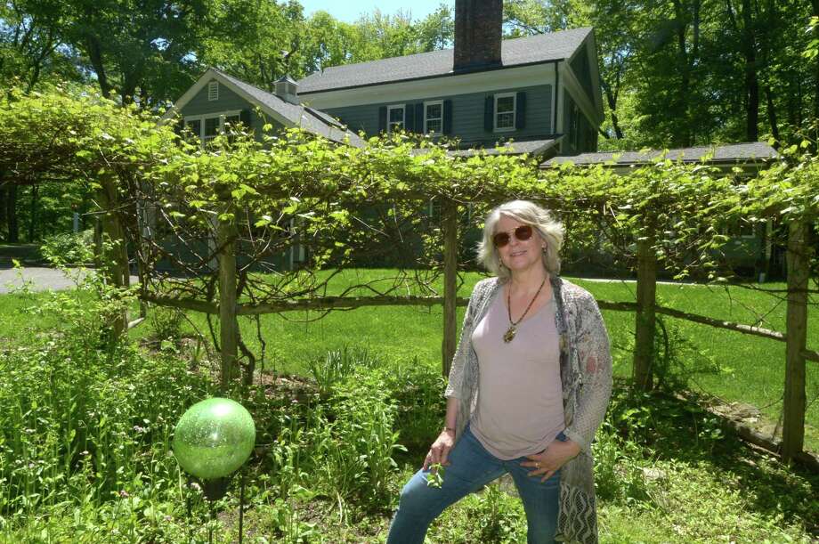 Karen Kissling is looking to sell her Cornell built, Federal style, the 2972 square foot Center Hall Colonial Wednesday, May 23, 2018, in Wilton, Conn.The home is only steps away from the United States National Park Weir Farm. Photo: Erik Trautmann / Hearst Connecticut Media / Norwalk Hour