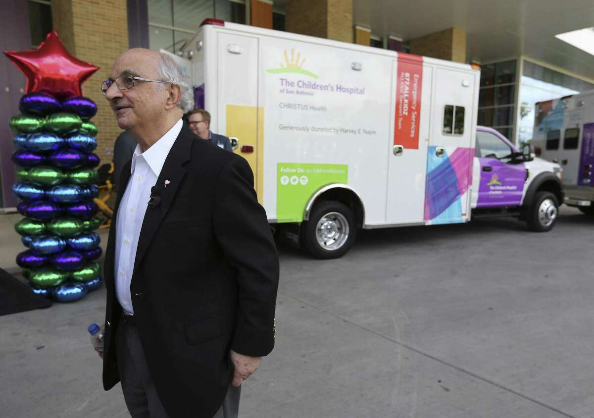 Local philanthropist Harvey E. Najim fields questions near two ambulances purchased with $1.4 million he donated to the Children’s Hospital of San Antonio on Thursday, May 24, 2018.
