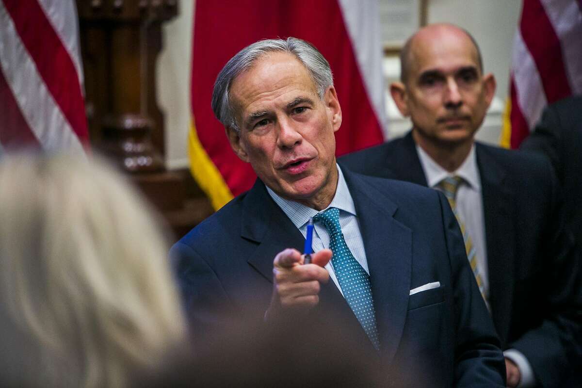 FILE - Texas Gov. Greg Abbott holds a roundtable discussion with victims, family, and friends affected by the Santa Fe, Texas school shooting at the state capital on May 24, 2018 in Austin, Texas. Sources close to the Houston Chronicle say Abbott is expected to announce additional armed security at schools, fortified school entrances and enhanced mental health services Wednesday morning. >> See the victims who lost their lives in the deadly Santa Fe High School Shootings.