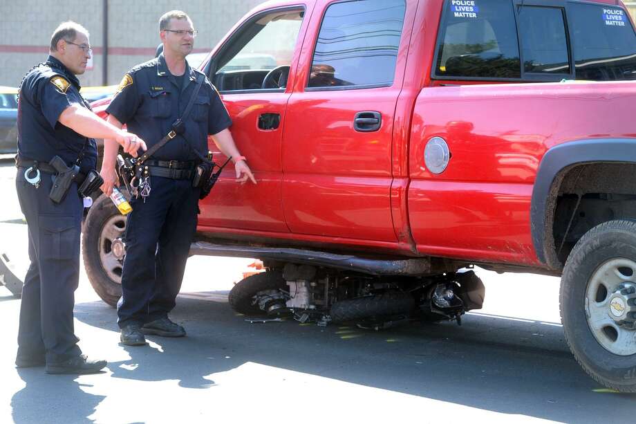 Image result for motorcycle under truck