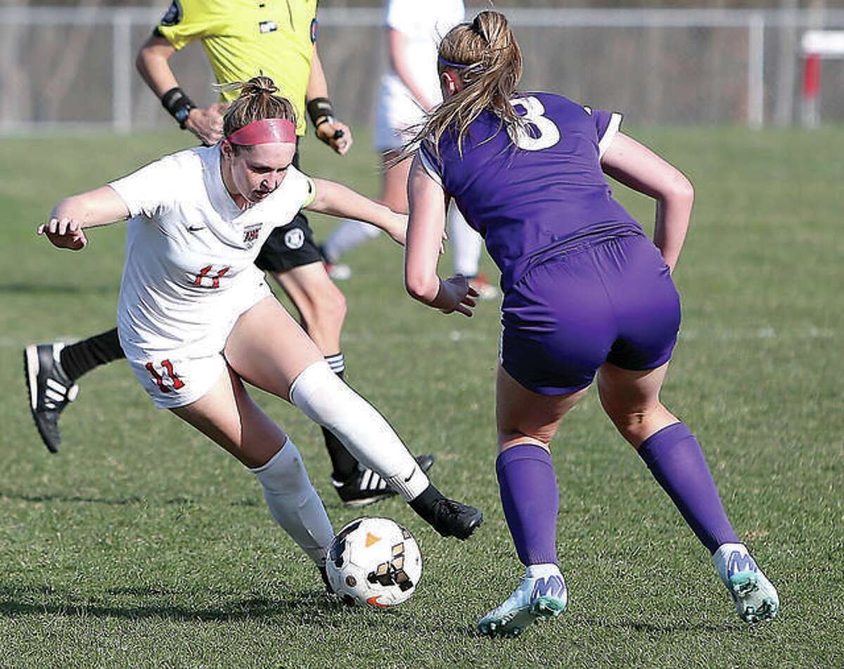 Alton’s Brianna Hatfield (11) repeated as an Illinois High School Soccer Coaches Association All-State selection in voting that was announced Thursday. She is shown in action against Collinsville earlier this season.