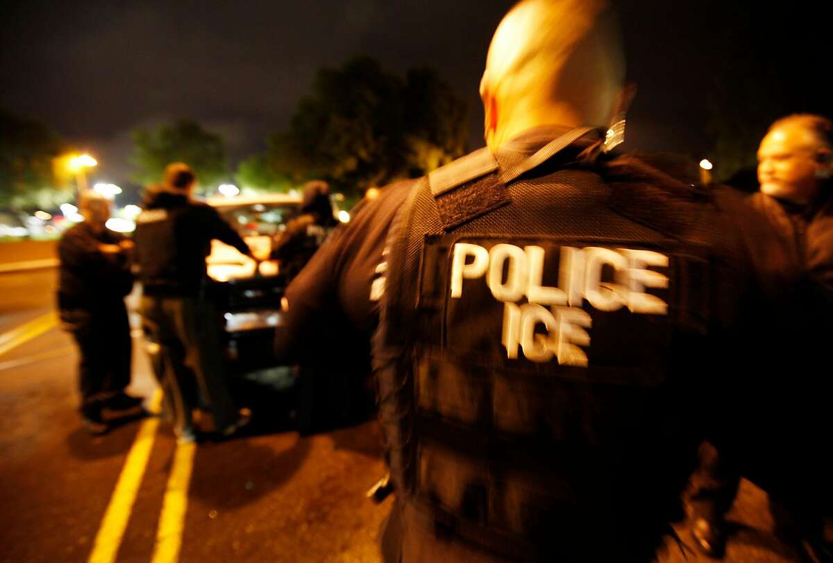 U.S. Immigration and Customs Enforcement ICE agents plan an early morning action on Monday March 26, 2012 at the Los Angeles Sheriff Station parking lot in Valencia, Calif. (Al Seib/Los Angeles Times/TNS)