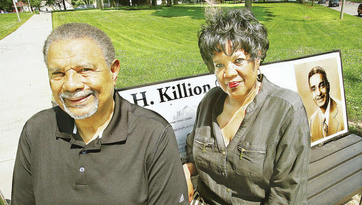 James Killion III and his sister, Carol Killion Hudson, sit on the bench at the corner of the Alton park named after their father, James H. Killion Park at Salu. Their father would have been 100 years old today.