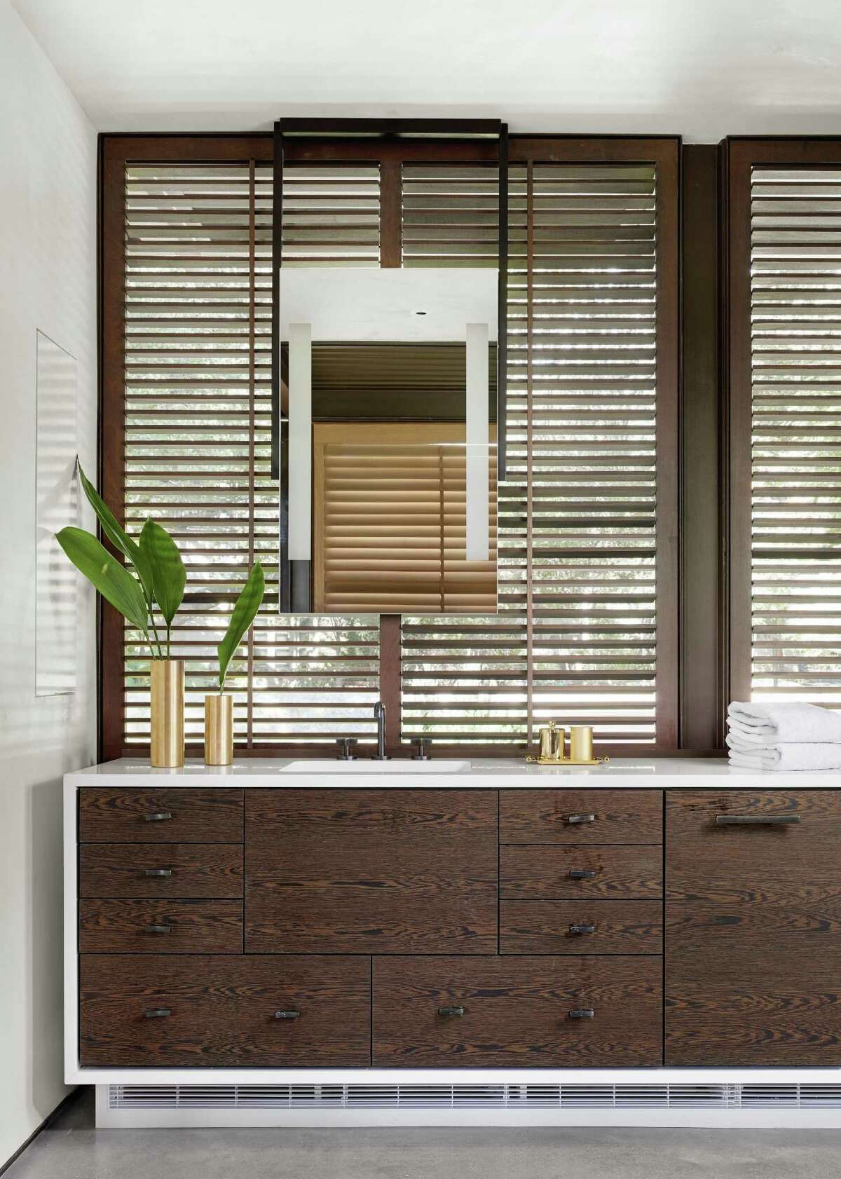 Wood has become a popular, if, perhaps, unintuitive, material sometimes used in master bathrooms. Properly sealed and maintained, woods such as white oak and mesquite not only look luxurious, but they?’ll also be able to withstand the rigors (and humidity) of a master bath for many years.