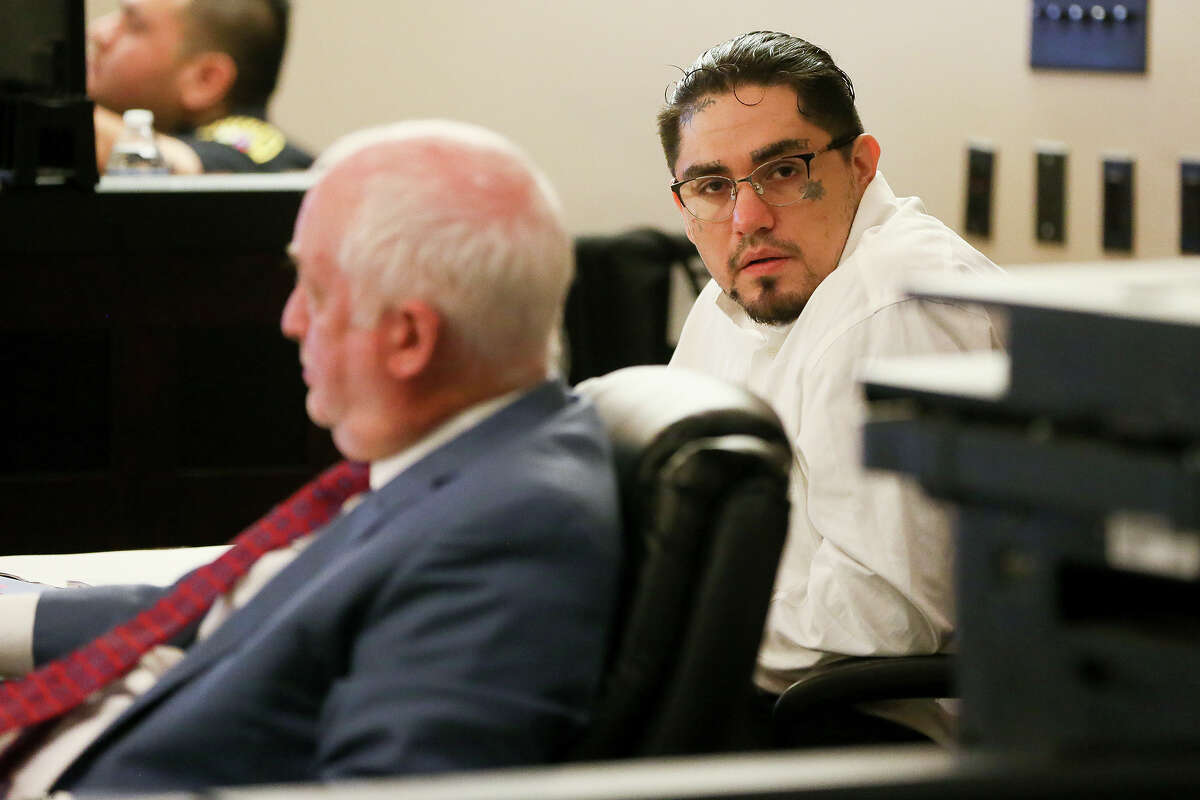Daniel Moreno Lopez (right), 31, sits in the courtroom with defense attorney J Charles Bunk during the first day of testimony in his retrial of in the 379th state District Court at the Cadena-Reeves Justice Center on Friday, May 25, 2017. Lopez is one of three defendants charged with killing Jose Luis Menchaca who was beaten with aluminum baseball bats, his limbs cut off and grilled on a barbecue pit. Lopez's first trial in March, 2017 ended in a mistrial. MARVIN PFEIFFER/mpfeiffer@express-news.net
