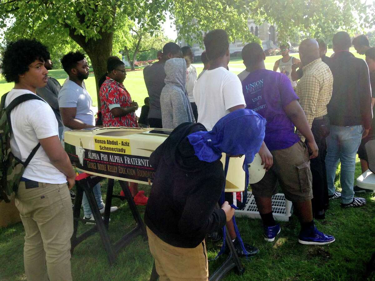 Teens take part in a soapbox derby through the Schenectady school district's My Brother's Keeper program on the Union College campus on Thursday, May 24, in Schenectady, N.Y. The youngsters, mostly African-American, say constructing the cars taught them about match and science and the importance of team work. (Paul Nelson/Times Union)