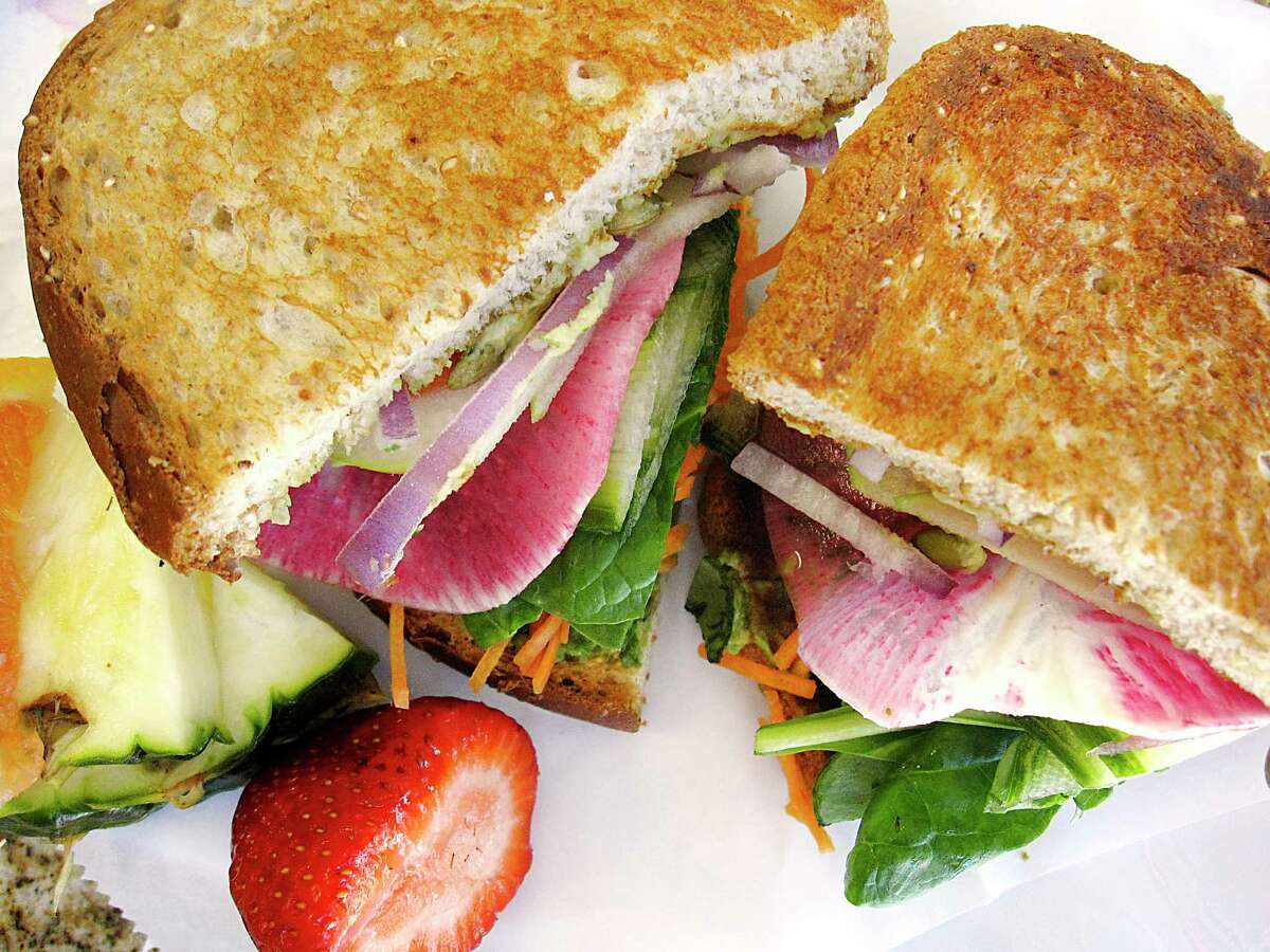 The Awesome Rawsome sandwich includes avocado, jalapeño hummus, watermelon radish, carrots, tomato, spinach and pumpkin seeds at Thyme for Lunch, which has relocated from Stone Oak to the Medical Center area.